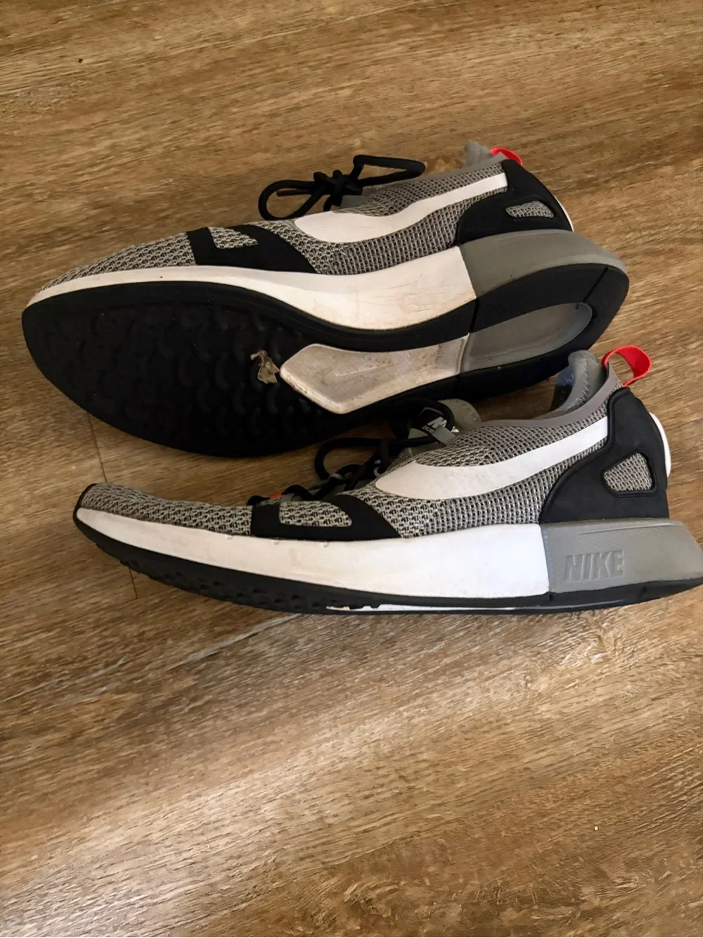 Nike Gray Mesh Running Shoes with White Swoosh and Red Interior